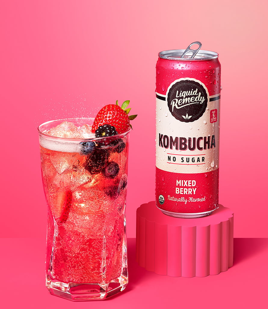 Liquid Remedy Mixed Berry Kombucha Can with Glass Lifestyle
