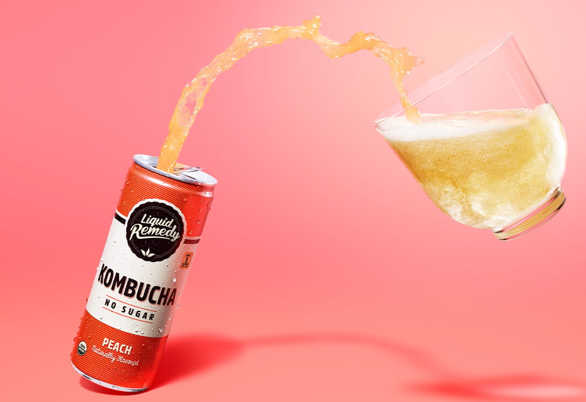 Liquid Remedy Peach Kombucha Pouring into Glass
