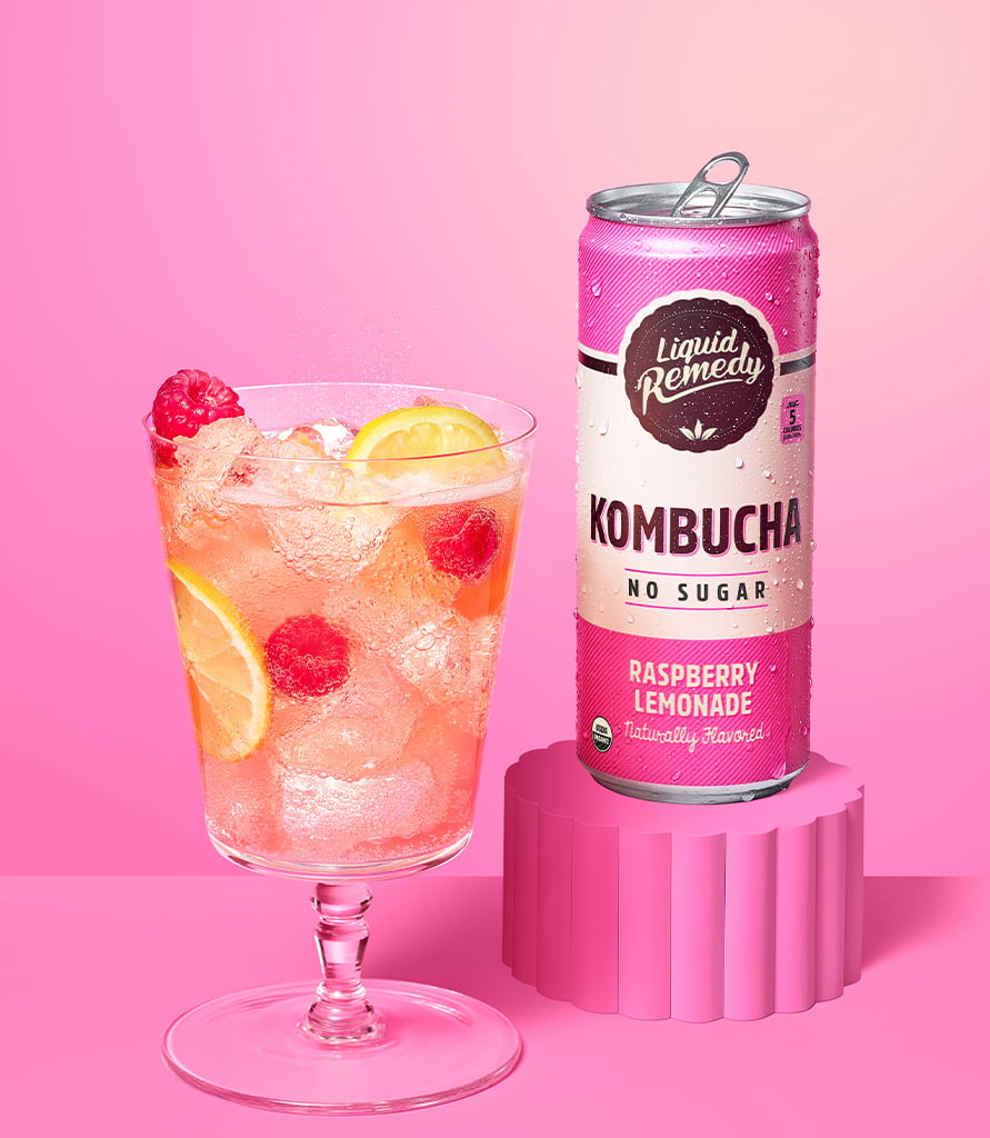 Liquid Remedy Raspberry Lemonade Kombucha Can with Glass Lifestyle